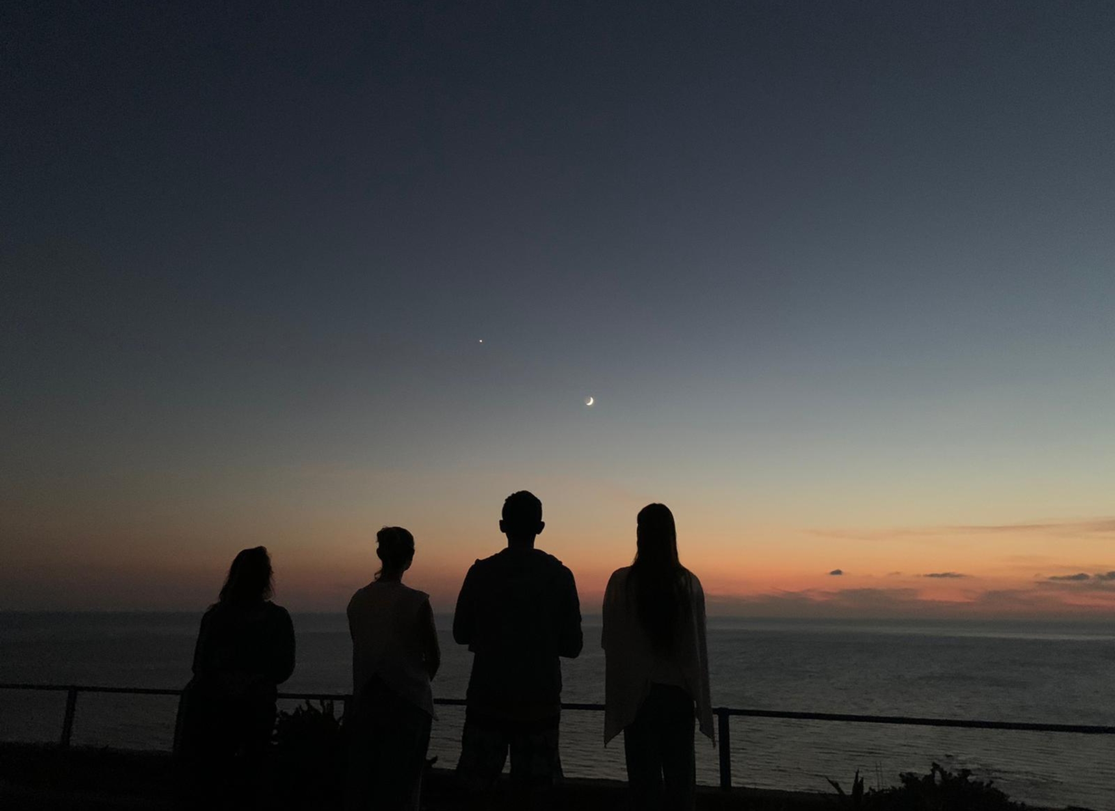 Four yogis gaze at the night sky above the yoga ashram in Triopetra.